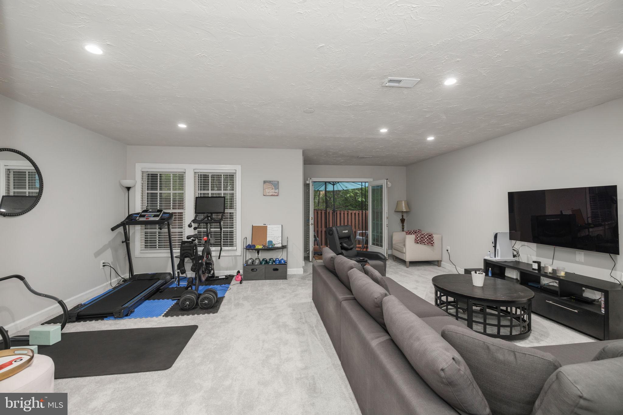 6337 Simmer Circle Springfield, VA 22150 - Photo 23 of 50 a living room with furniture and a flat screen tv