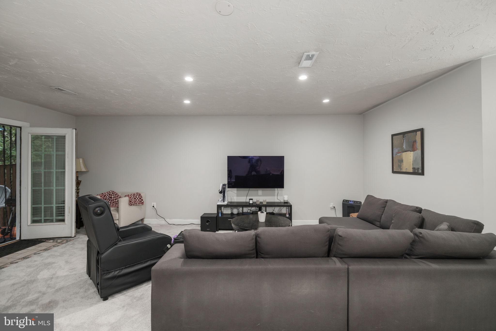 6337 Simmer Circle Springfield, VA 22150 - Photo 25 of 50 a living room with furniture and a flat screen tv