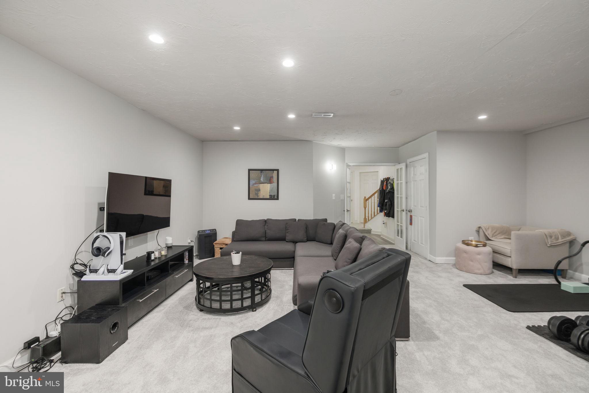 6337 Simmer Circle Springfield, VA 22150 - Photo 26 of 50 a living room with furniture and a flat screen tv