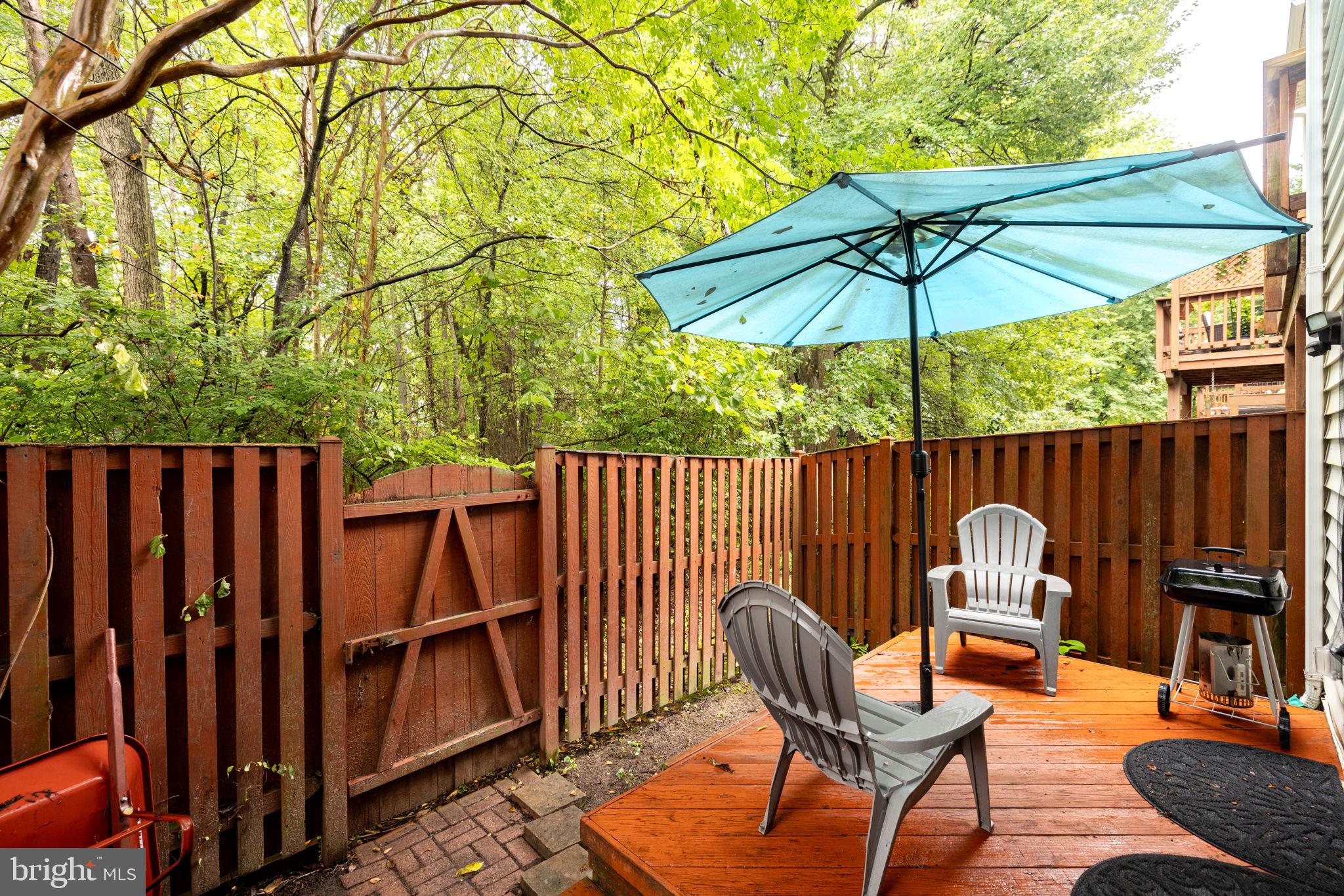 6337 Simmer Circle Springfield, VA 22150 - Photo 30 of 50 a backyard view with a seating space