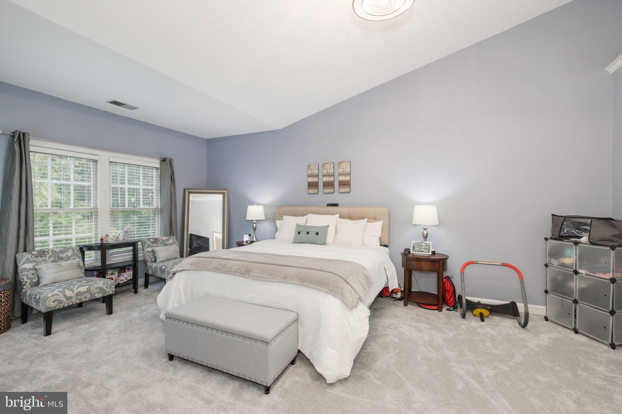 6337 Simmer Circle Springfield, VA 22150 - Photo 33 of 50 a bed room with a bed and a couch