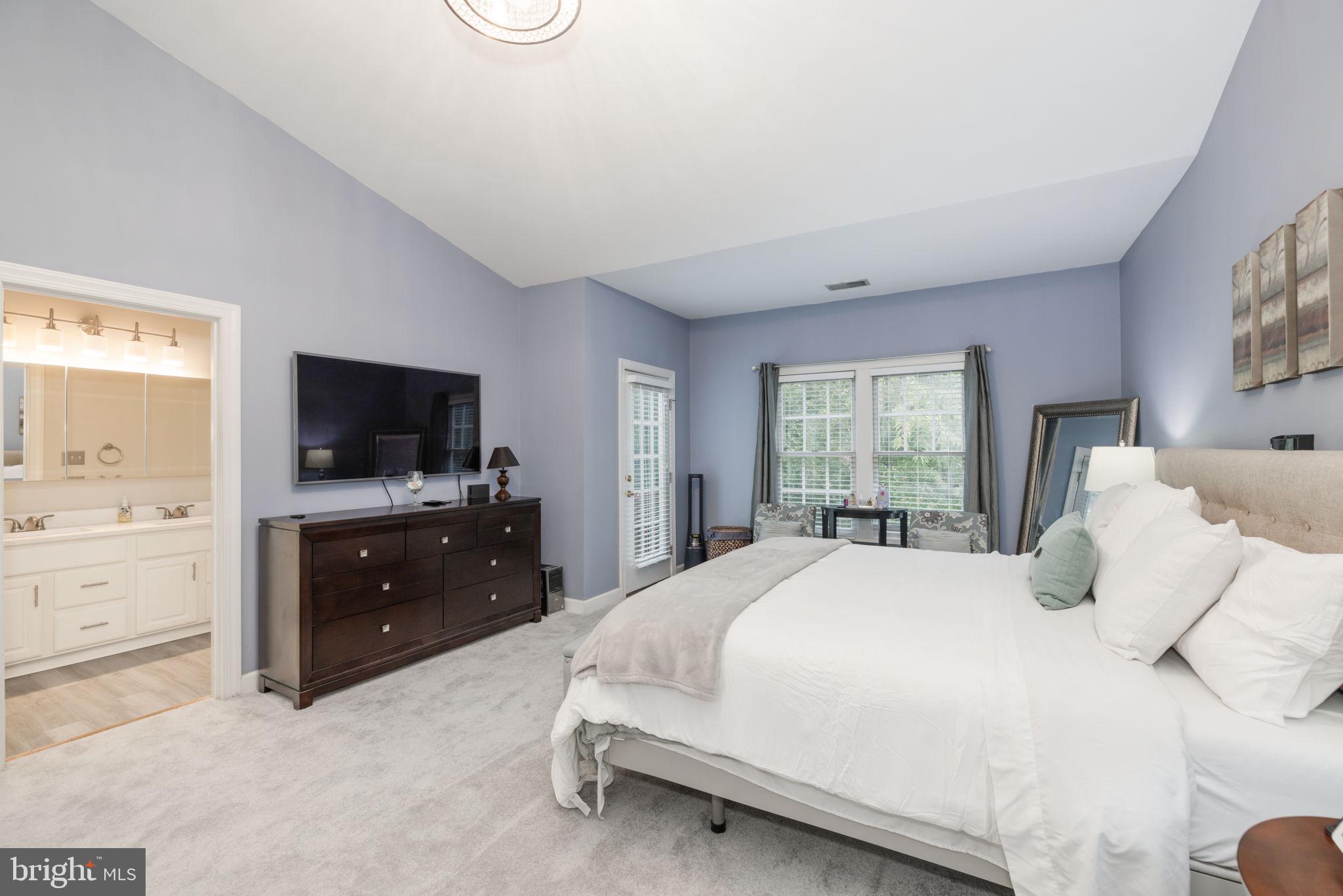 6337 Simmer Circle Springfield, VA 22150 - Photo 35 of 50 a bedroom with a bed and a flat screen tv