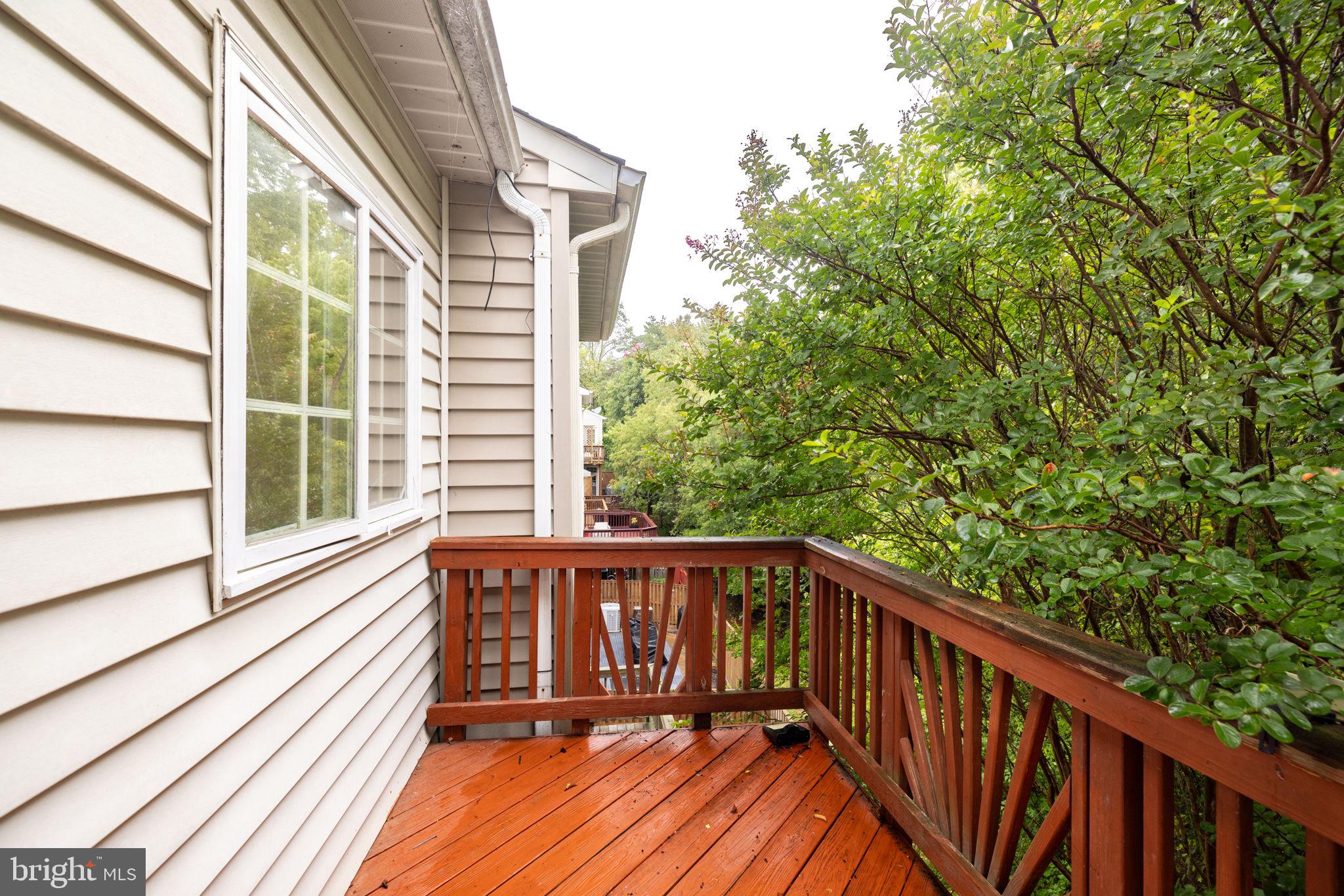 6337 Simmer Circle Springfield, VA 22150 - Photo 39 of 50 a view of balcony with wooden floor and fence