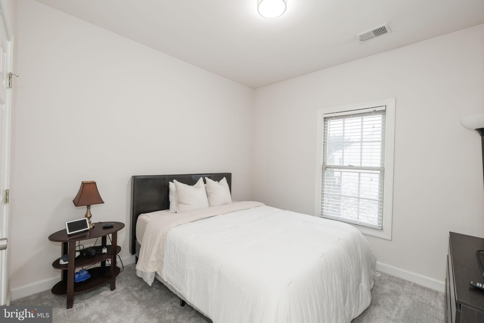 6337 Simmer Circle Springfield, VA 22150 - Photo 41 of 50 a bedroom with a bed and a window