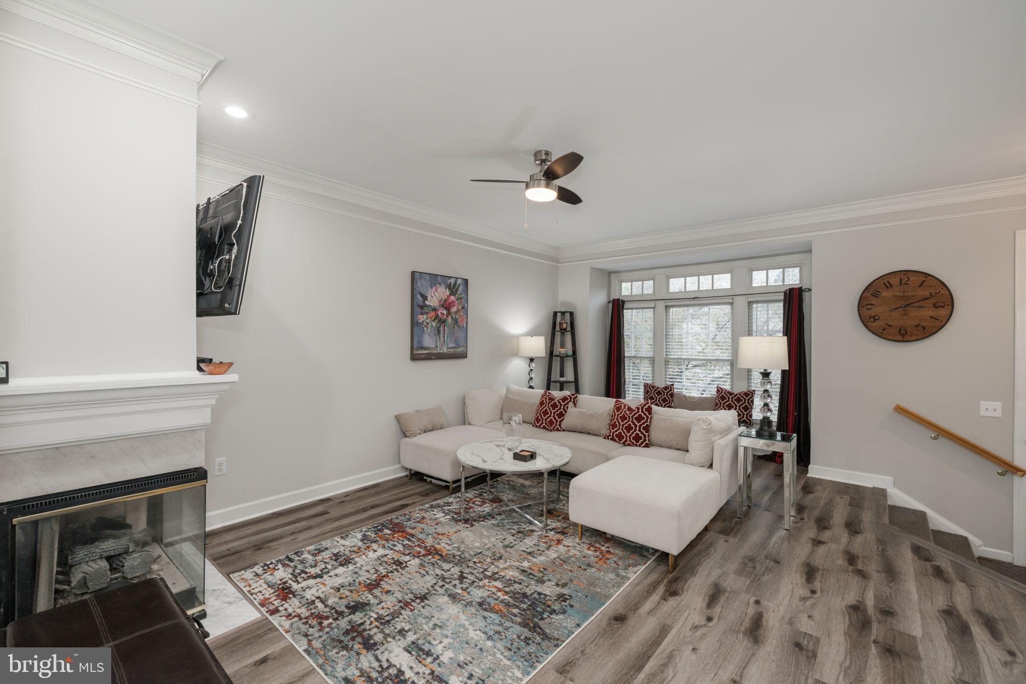 6337 Simmer Circle Springfield, VA 22150 - Photo 5 of 50 a living room with furniture and a fireplace