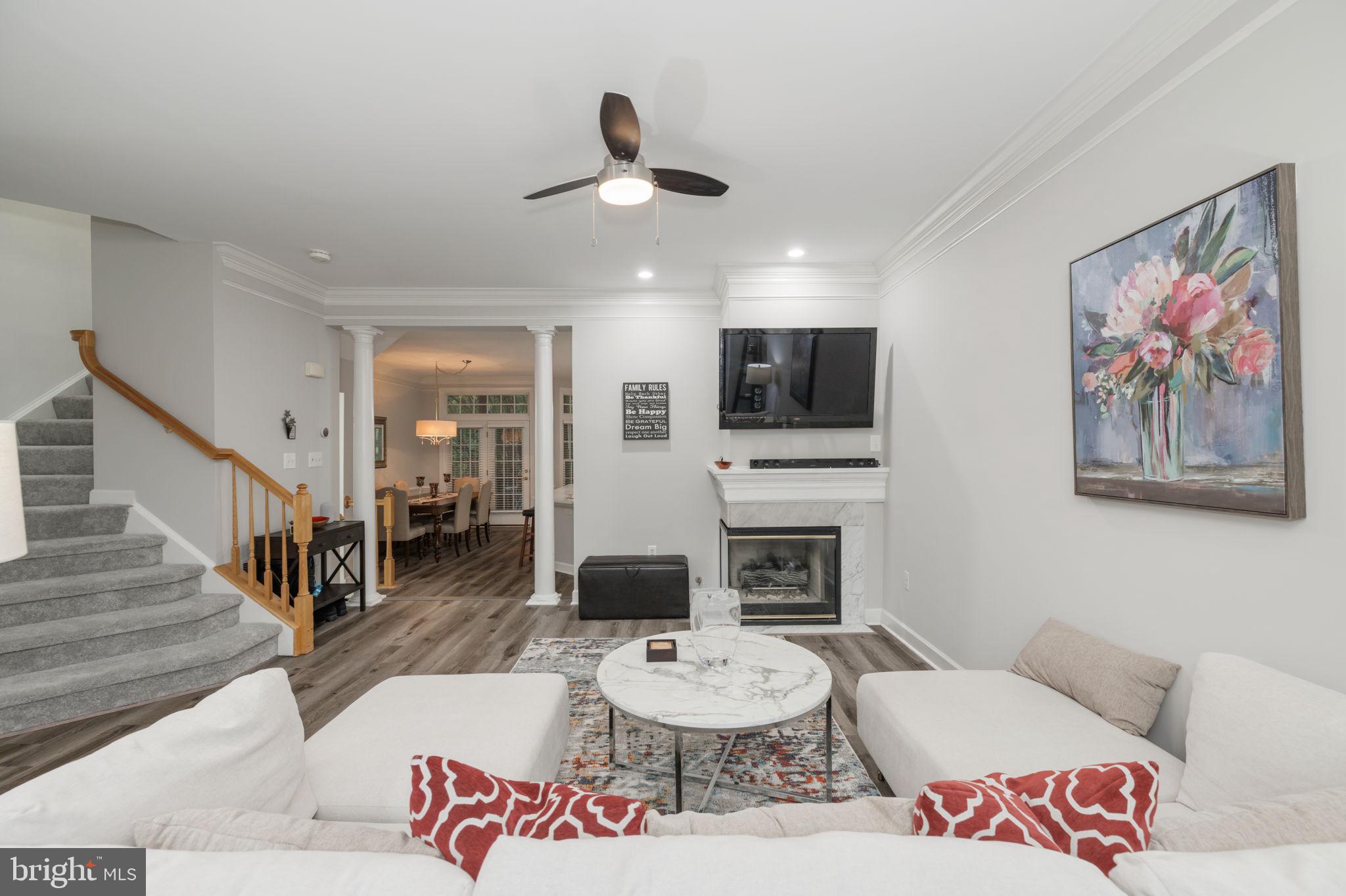 6337 Simmer Circle Springfield, VA 22150 - Photo 6 of 50 a living room with furniture and a fireplace