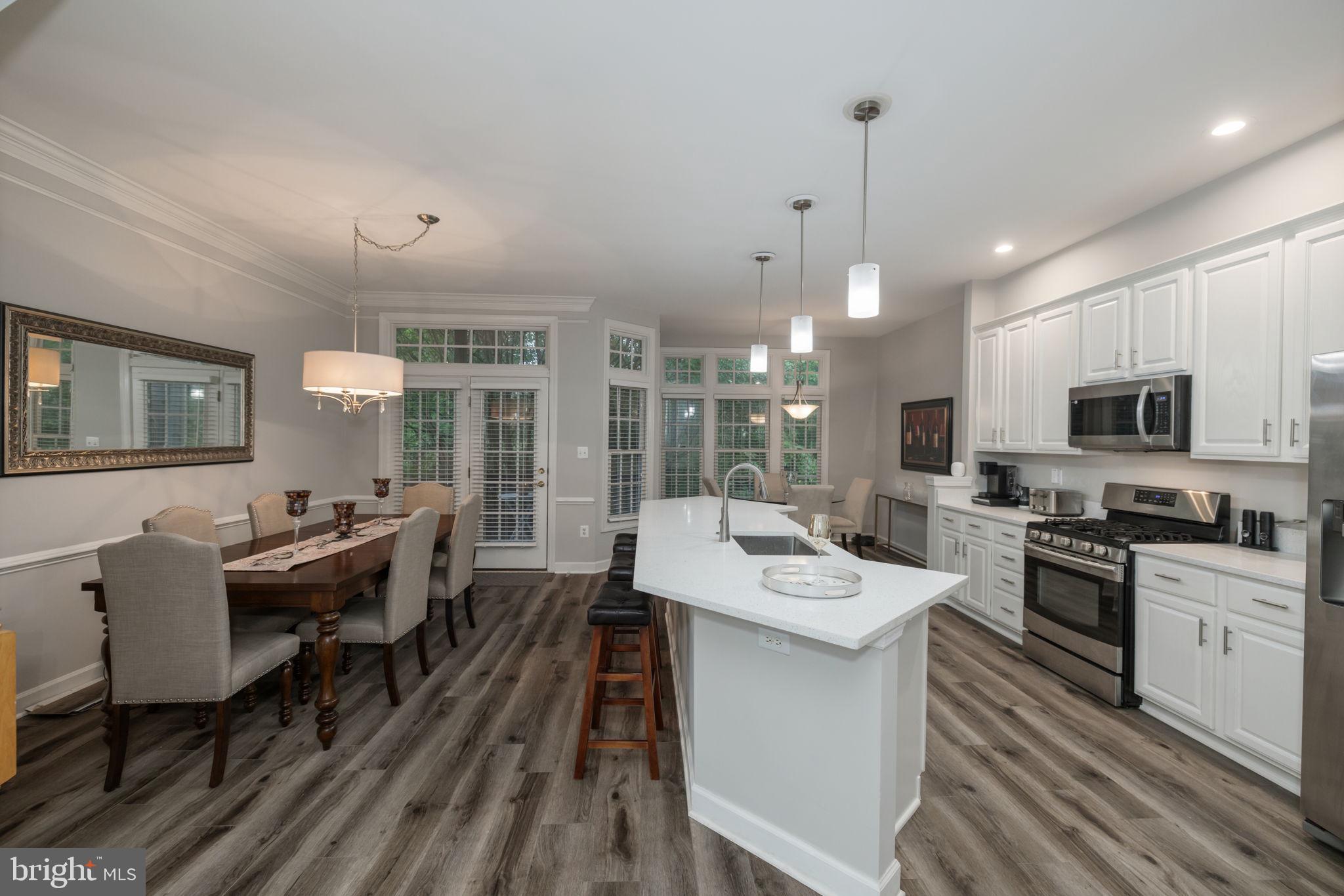 6337 Simmer Circle Springfield, VA 22150 - Photo 8 of 50 a large kitchen with a table and chairs