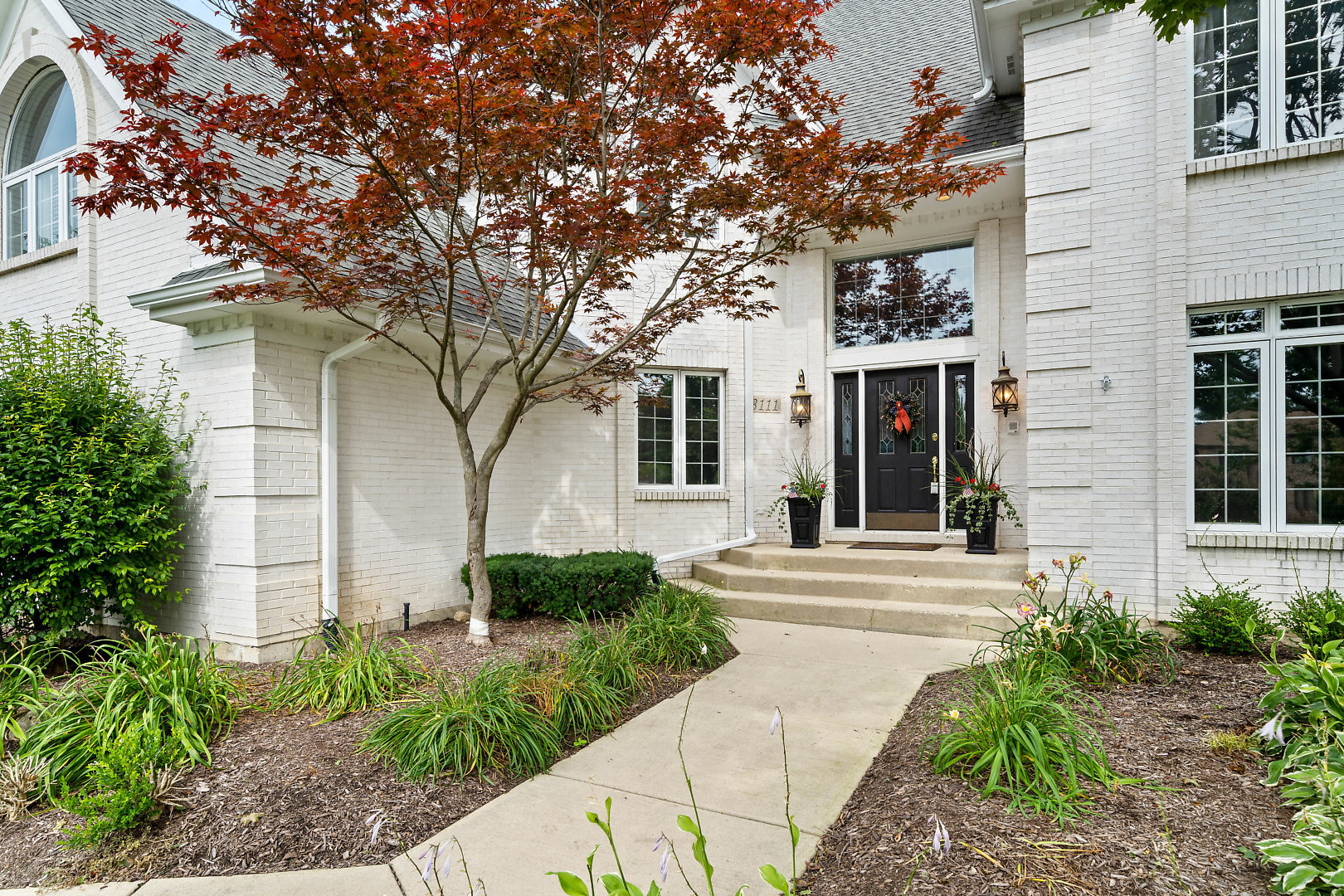 3111 Turnberry Road St. Charles, IL 60174 - Photo 2 of 34 a front view of a house with a yard