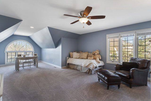 3111 Turnberry Road St. Charles, IL 60174 - Photo 22 of 34 a living room with furniture a large window and a chandelier