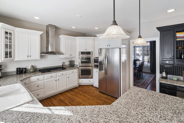 3111 Turnberry Road St. Charles, IL 60174 - Photo 7 of 34 a kitchen with stainless steel appliances granite countertop a refrigerator oven a sink a stove and a refrigerator