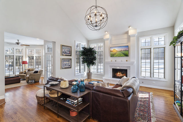3111 Turnberry Road St. Charles, IL 60174 - Photo 8 of 34 a living room with furniture a fireplace and a large window