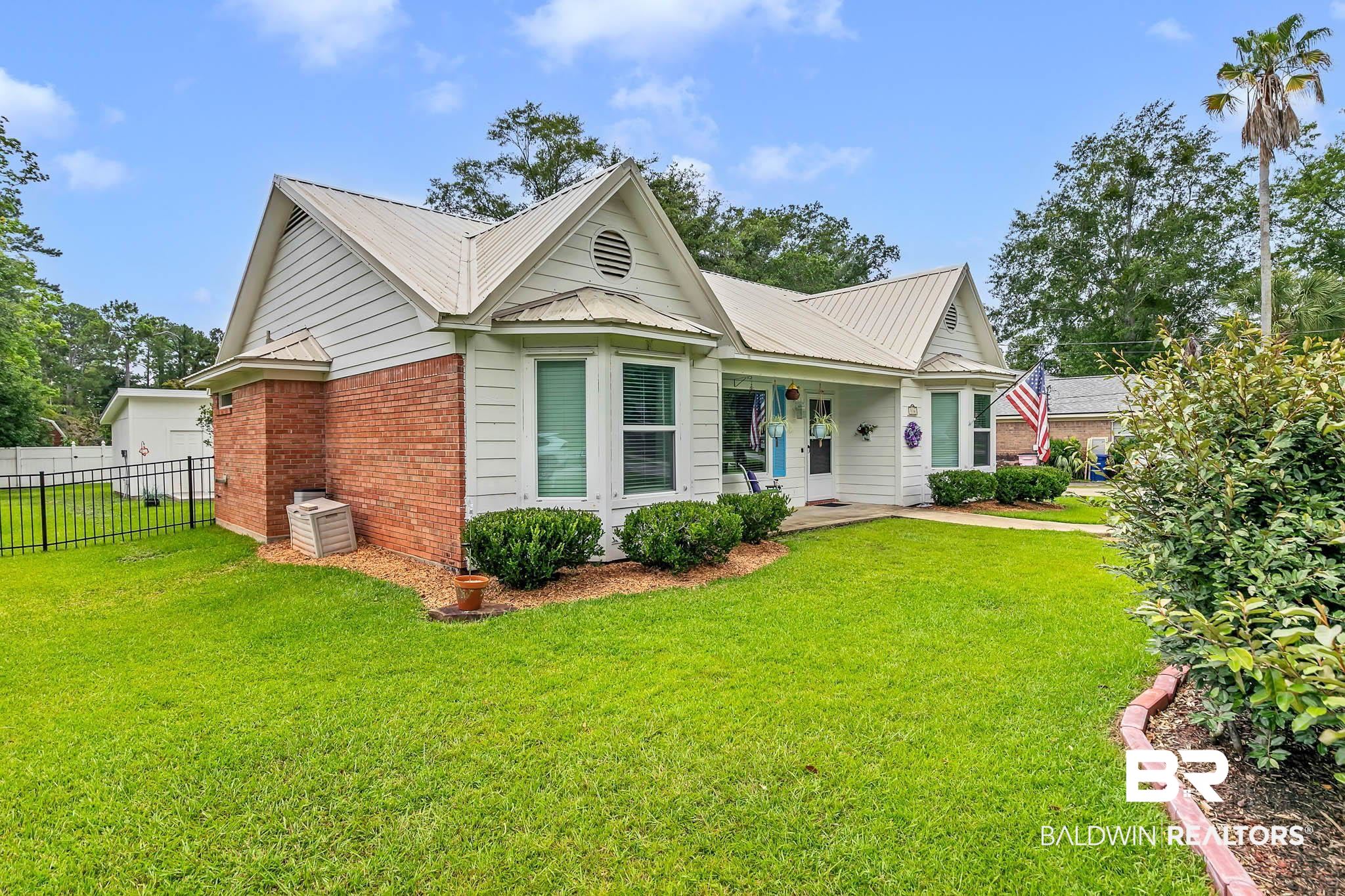 516 Juniper Place Drive Foley, AL 36535 - Photo 2 of 51 Ranch-style house featuring brick siding and a metal roof