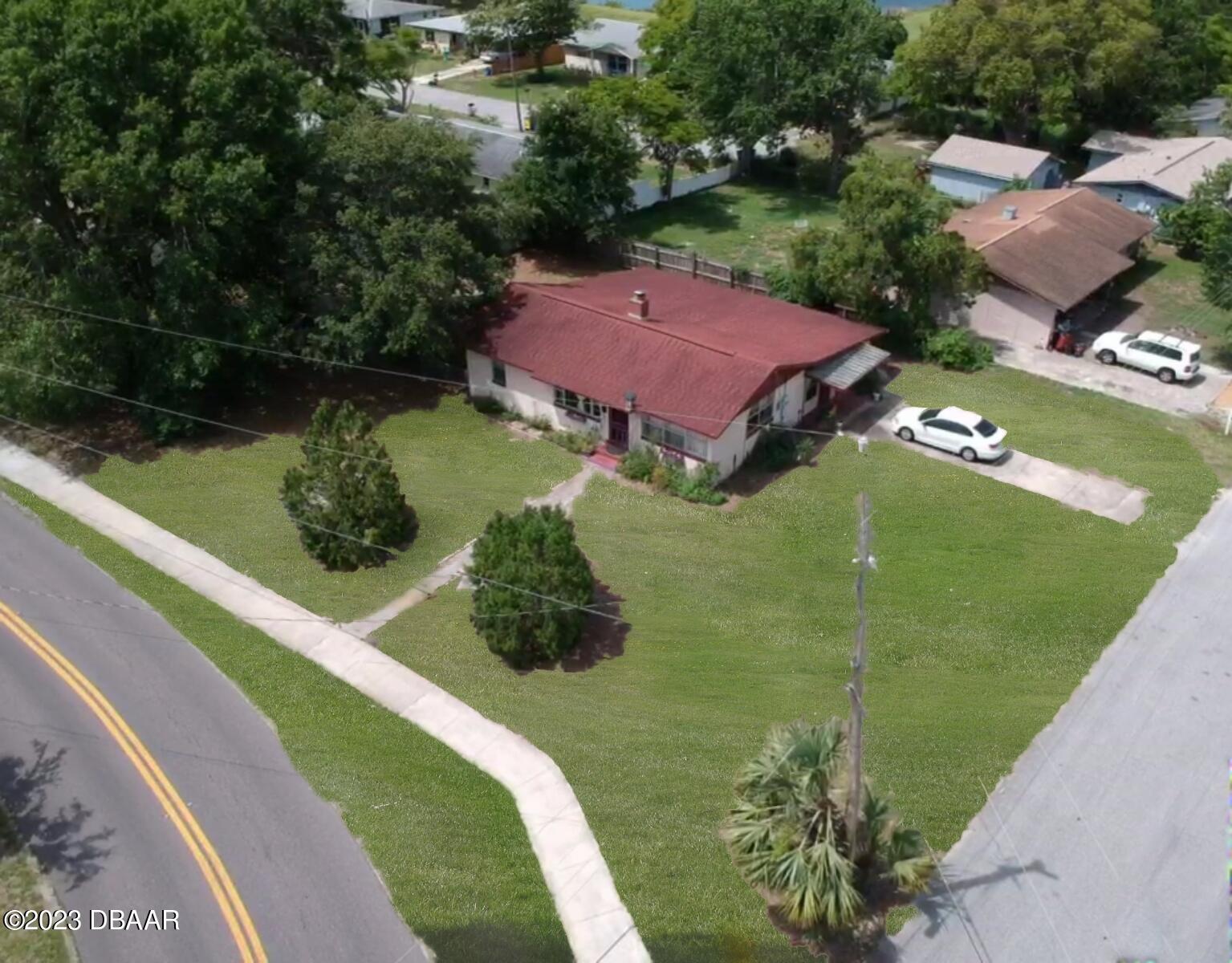 602 Flagler Avenue Edgewater, FL 32132 - Photo 2 of 15 a view of a big yard with potted plants