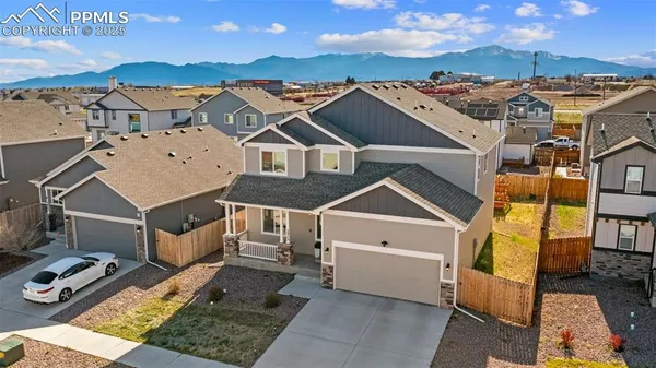 an aerial view of a house with a ocean view