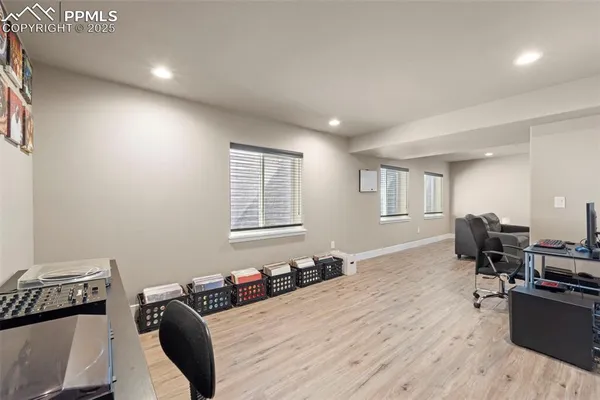 a bedroom with furniture and a window