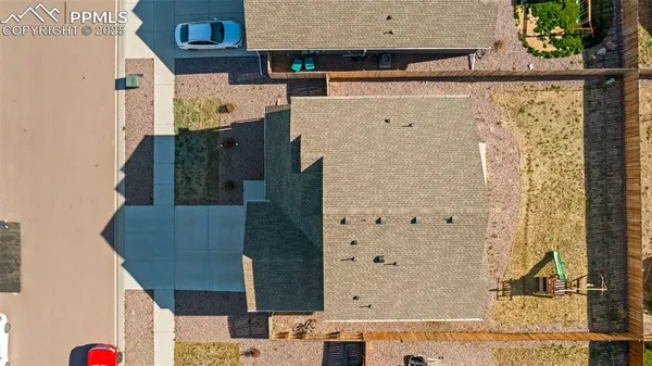 an aerial view of residential houses with outdoor space