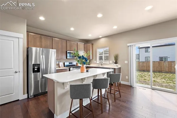 a kitchen with counter top space cabinets and stainless steel appliances