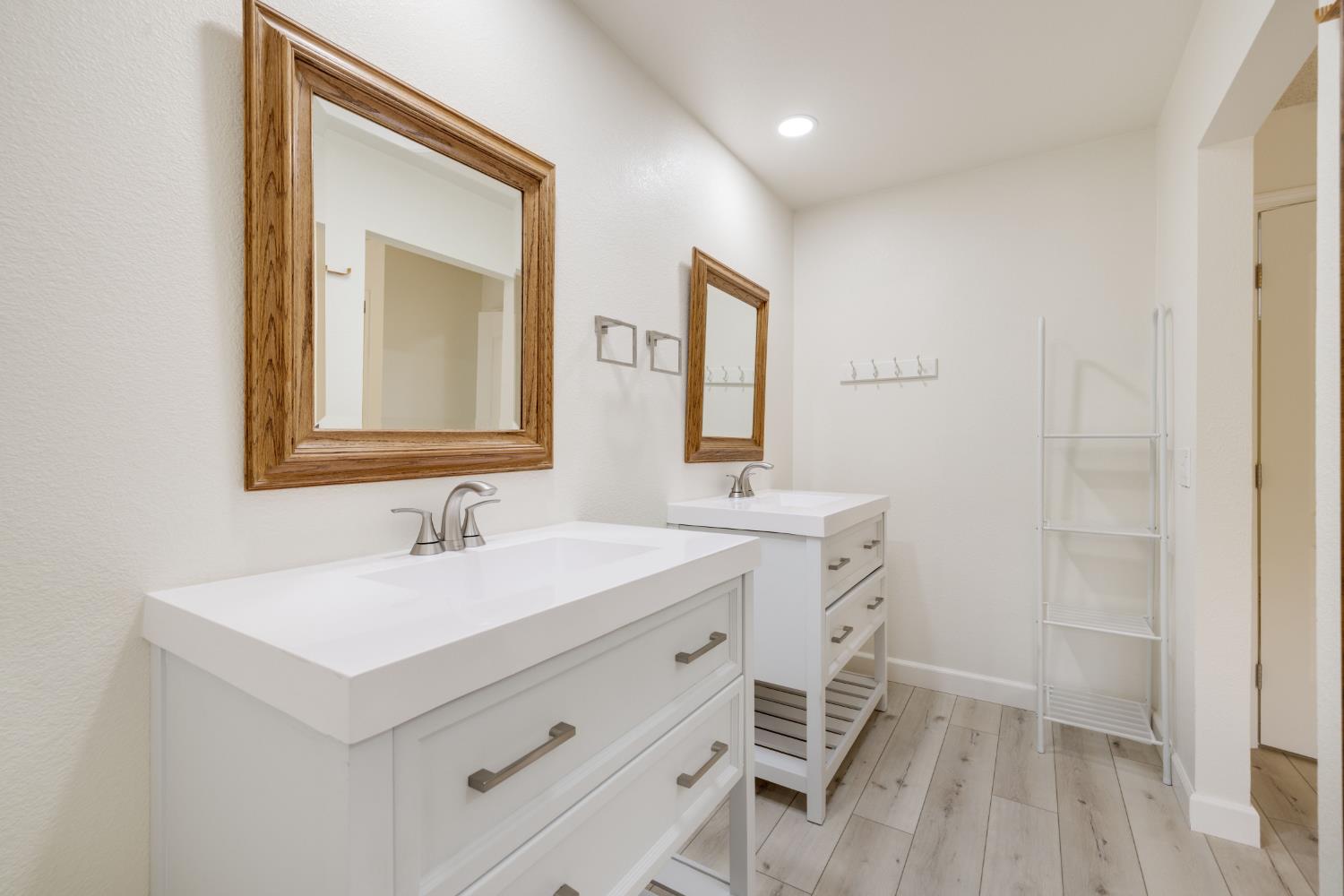 7118 Murdock Way Carmichael, CA 95608 - Photo 21 of 31 Primary Bath has solar tube plus recessed lighting, dual vanities. Separate room for toilet/shower area.