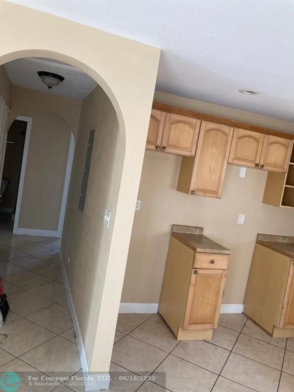 179 South Barfield Highway, Unit 1 Pahokee, FL 33476 - Photo 9 of 19 a view of a storage and utility room with closet