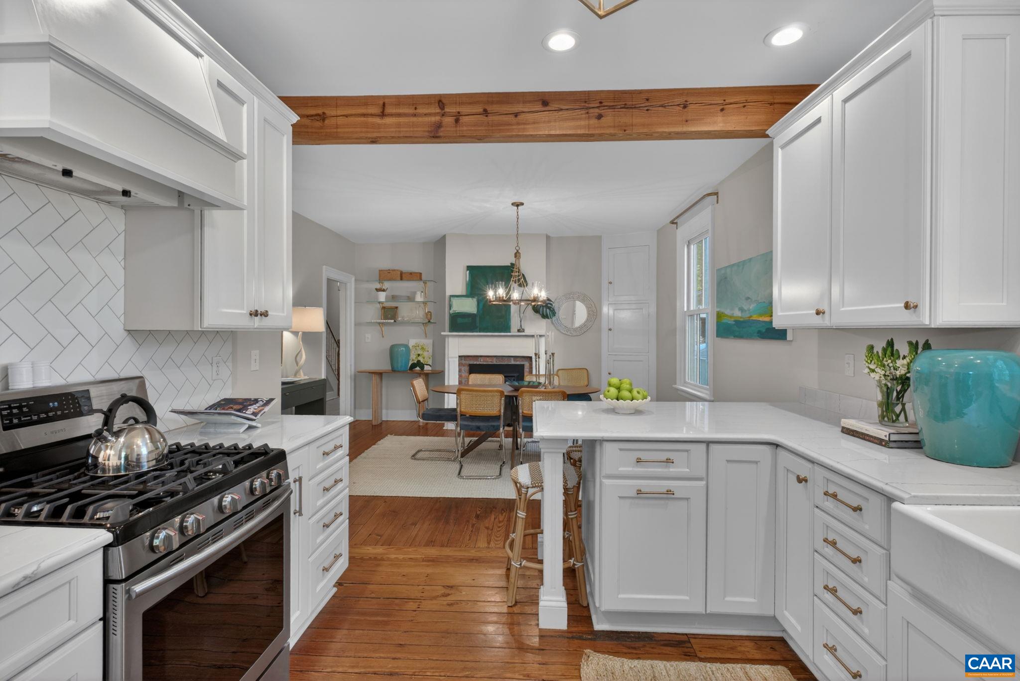623 Hinton Avenue Charlottesville, VA 22902 - Photo 17 of 35 a kitchen with white cabinets and appliances