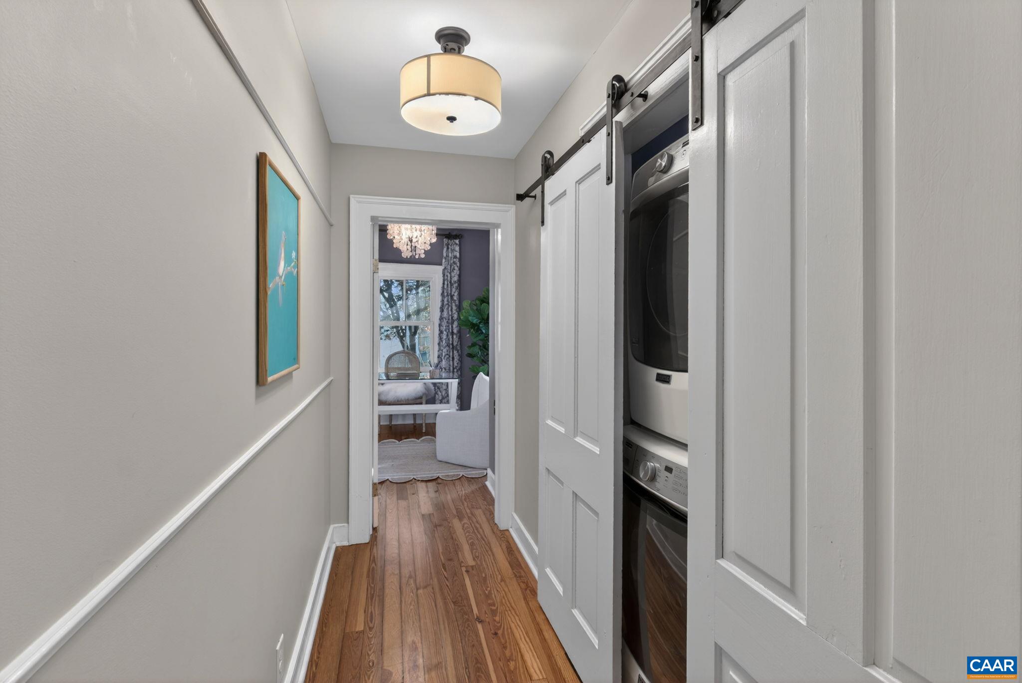 623 Hinton Avenue Charlottesville, VA 22902 - Photo 18 of 35 a view of a hallway with wooden floor and staircase