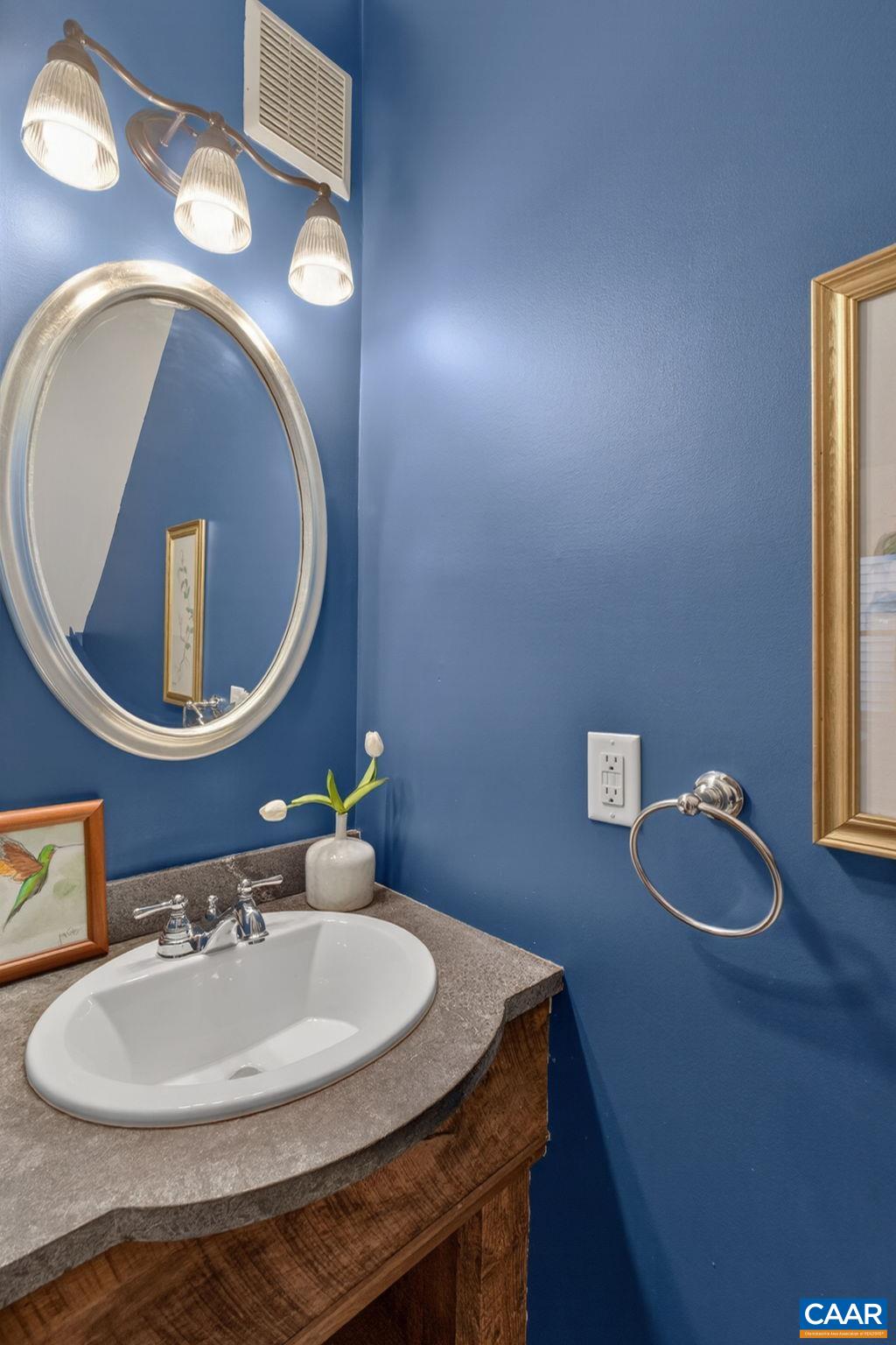 623 Hinton Avenue Charlottesville, VA 22902 - Photo 21 of 35 a bathroom with a sink mirror and vanity
