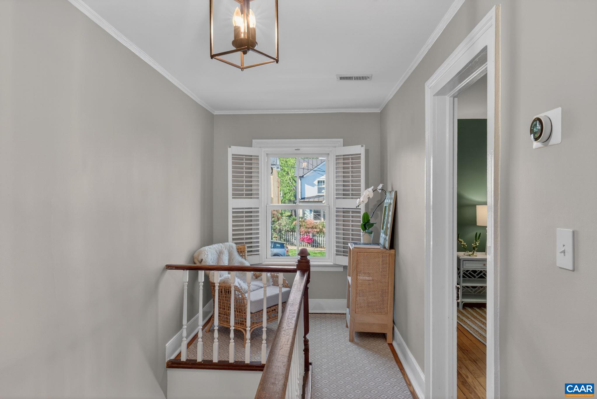 623 Hinton Avenue Charlottesville, VA 22902 - Photo 22 of 35 a view of a hallway with furniture and windows