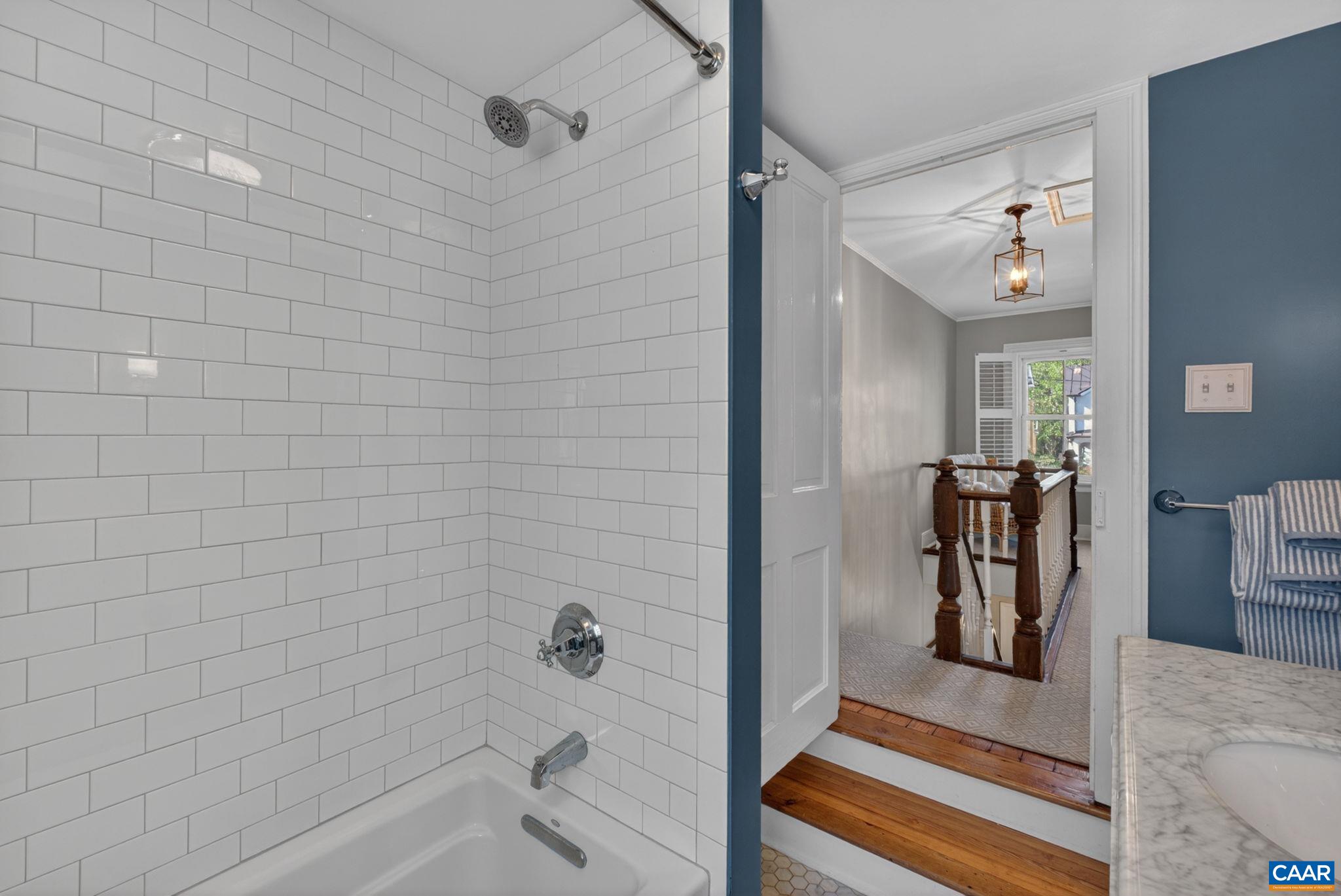 623 Hinton Avenue Charlottesville, VA 22902 - Photo 27 of 35 a bathroom with a bathtub and a shower