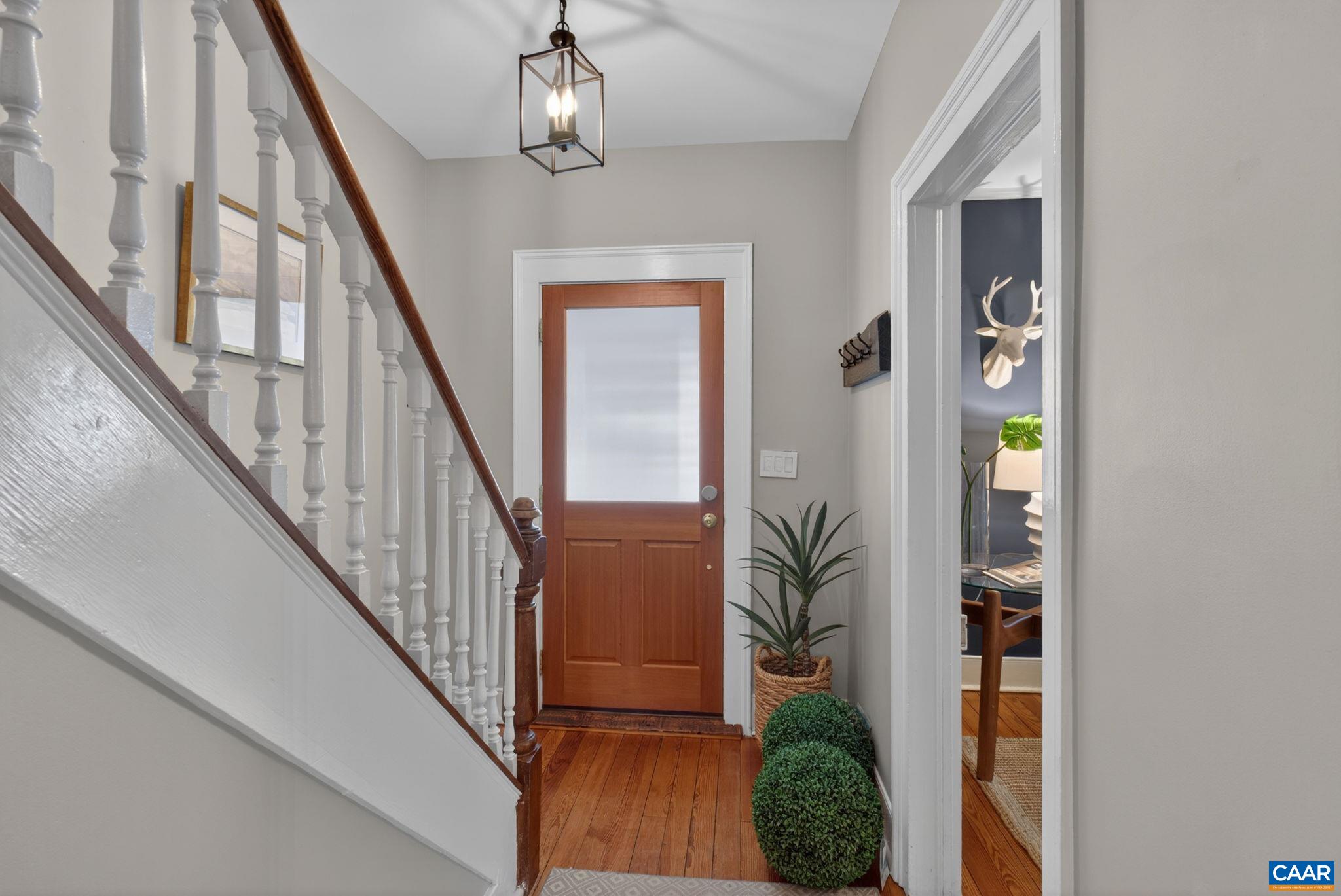 623 Hinton Avenue Charlottesville, VA 22902 - Photo 4 of 35 a view of an entryway with wooden floor and front door