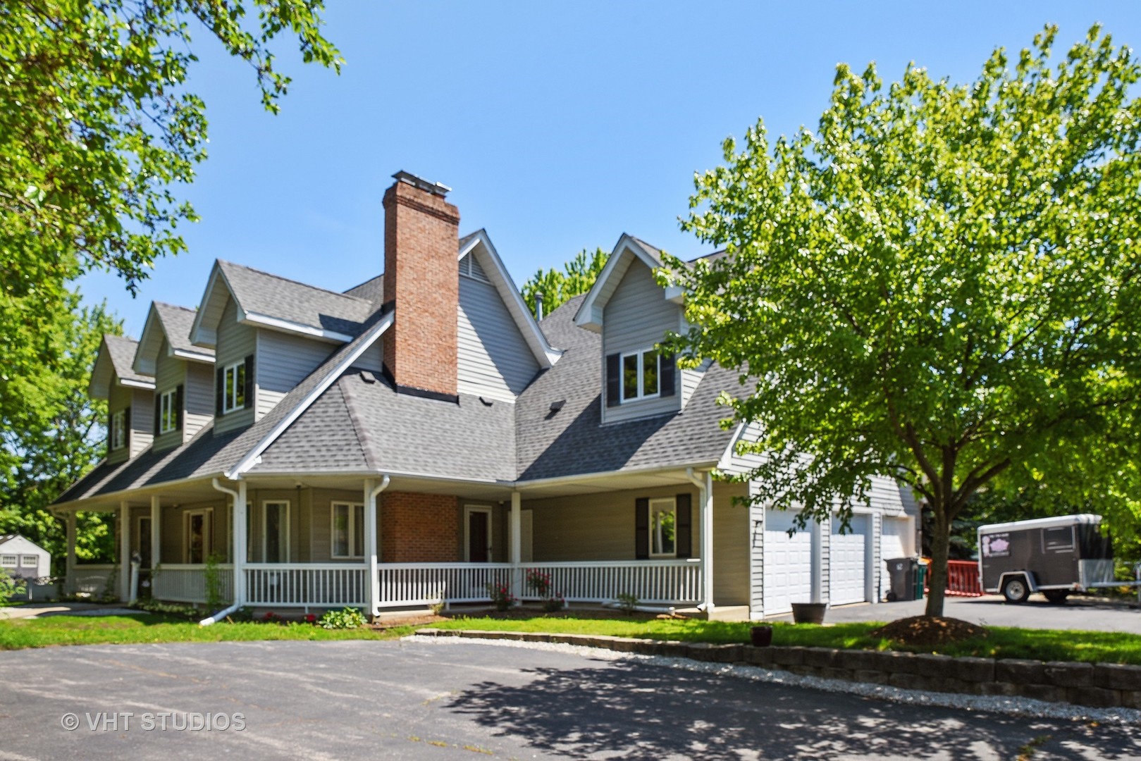 972 High Point Lane Streamwood, IL 60107 - Photo 1 of 26 a front view of a house with garden