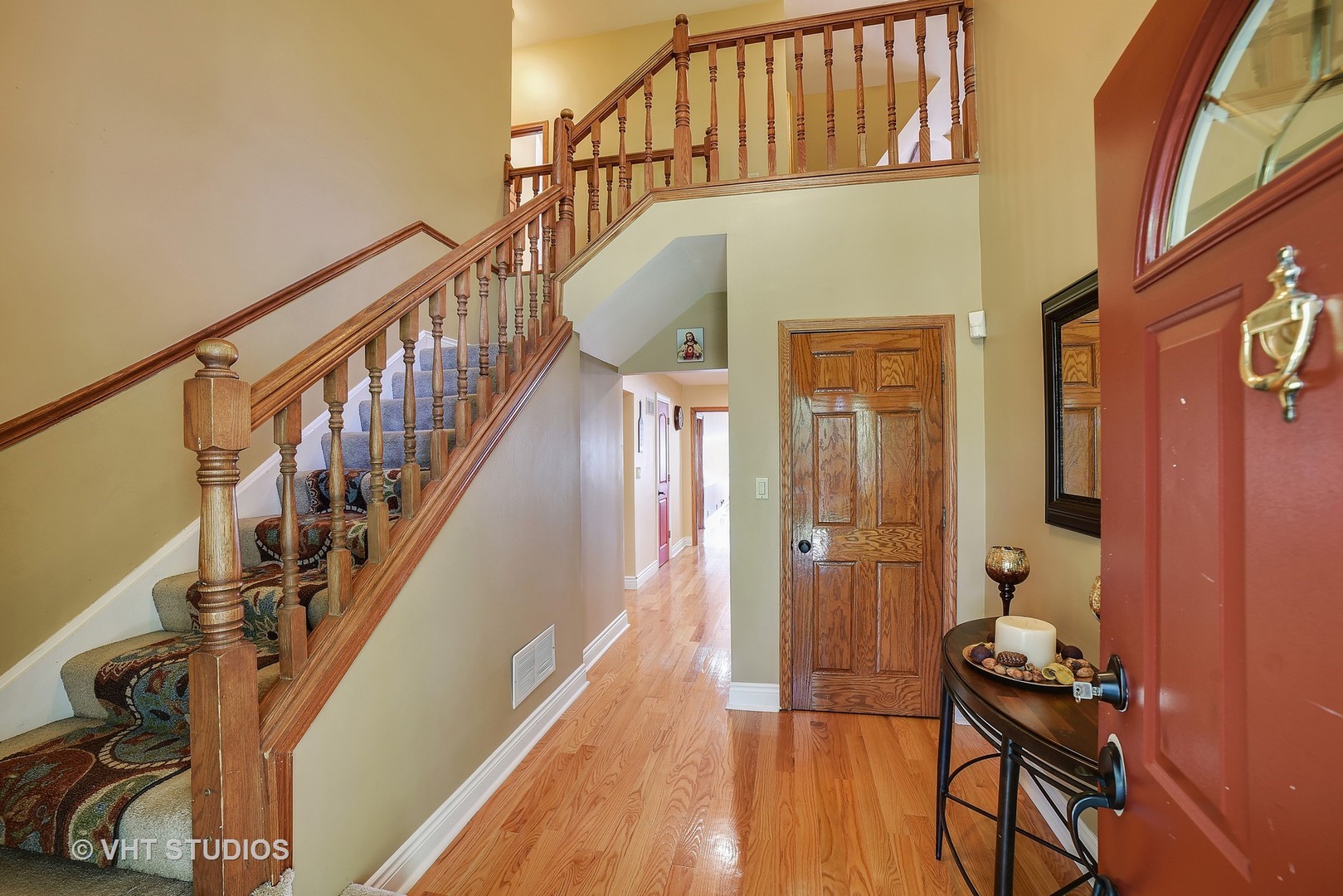 972 High Point Lane Streamwood, IL 60107 - Photo 2 of 26 a view of a hallway with wooden floor and staircase