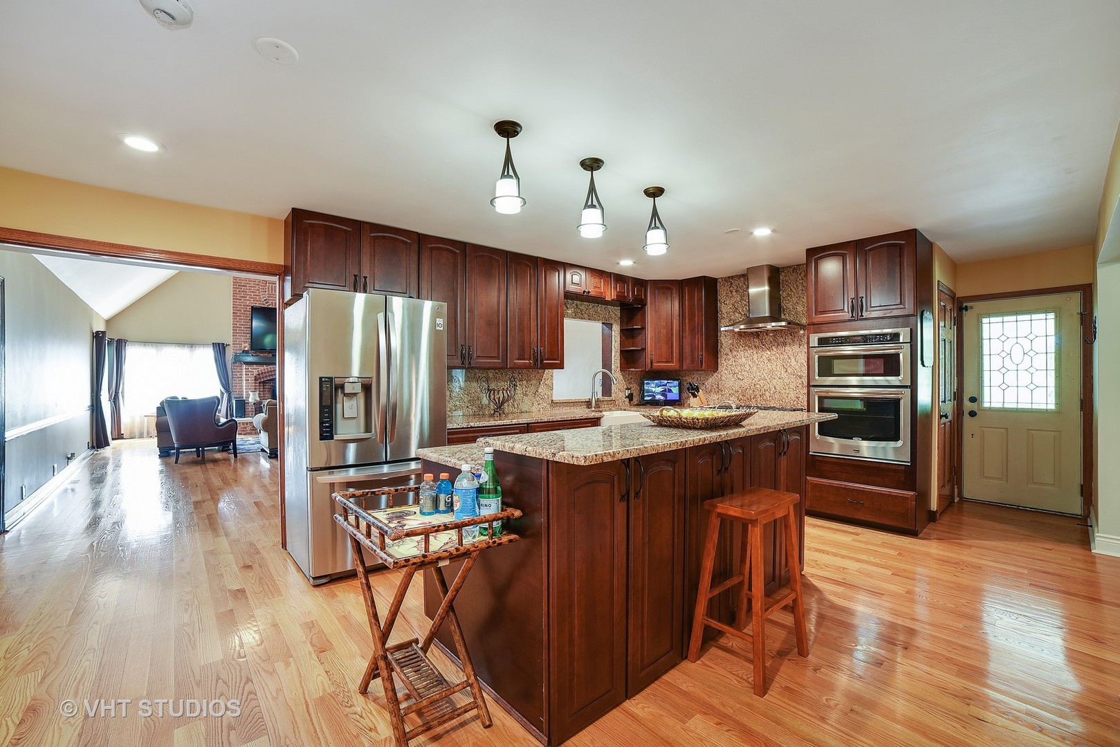 972 High Point Lane Streamwood, IL 60107 - Photo 3 of 26 a kitchen with stainless steel appliances granite countertop a refrigerator a sink dishwasher a stove and a refrigerator with wooden floor