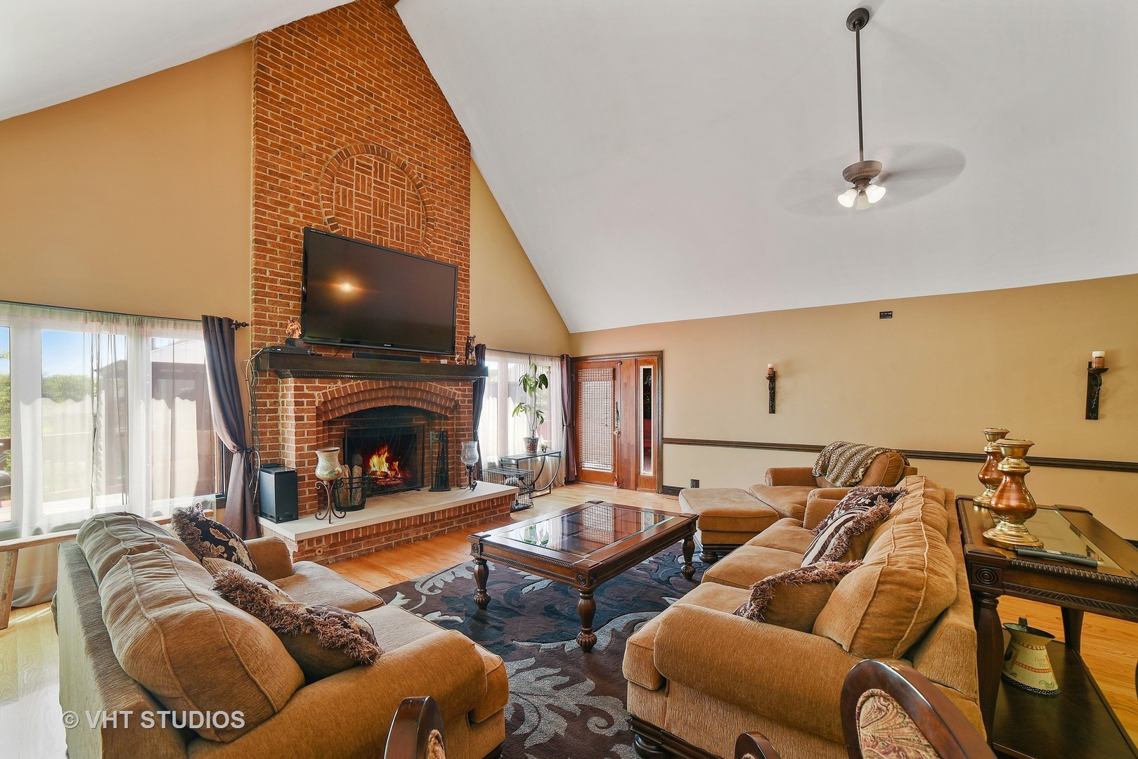 972 High Point Lane Streamwood, IL 60107 - Photo 5 of 26 a living room with furniture a fireplace and a flat screen tv