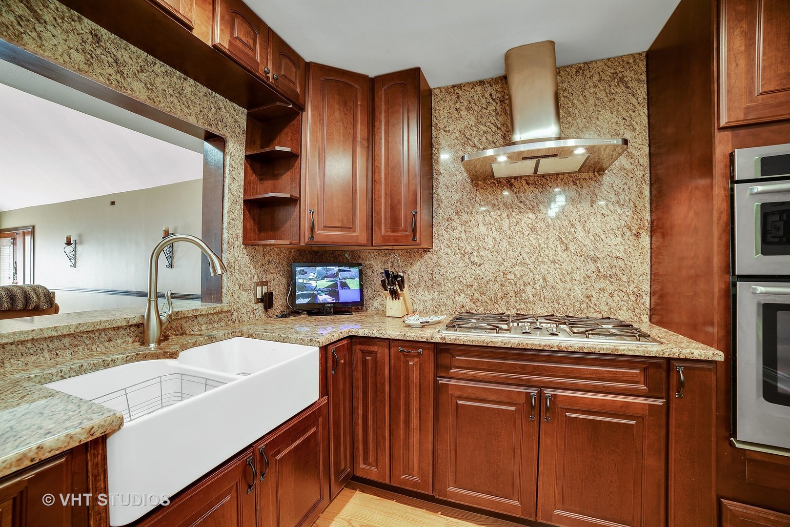 972 High Point Lane Streamwood, IL 60107 - Photo 7 of 26 a kitchen with stainless steel appliances granite countertop a sink stove and cabinets