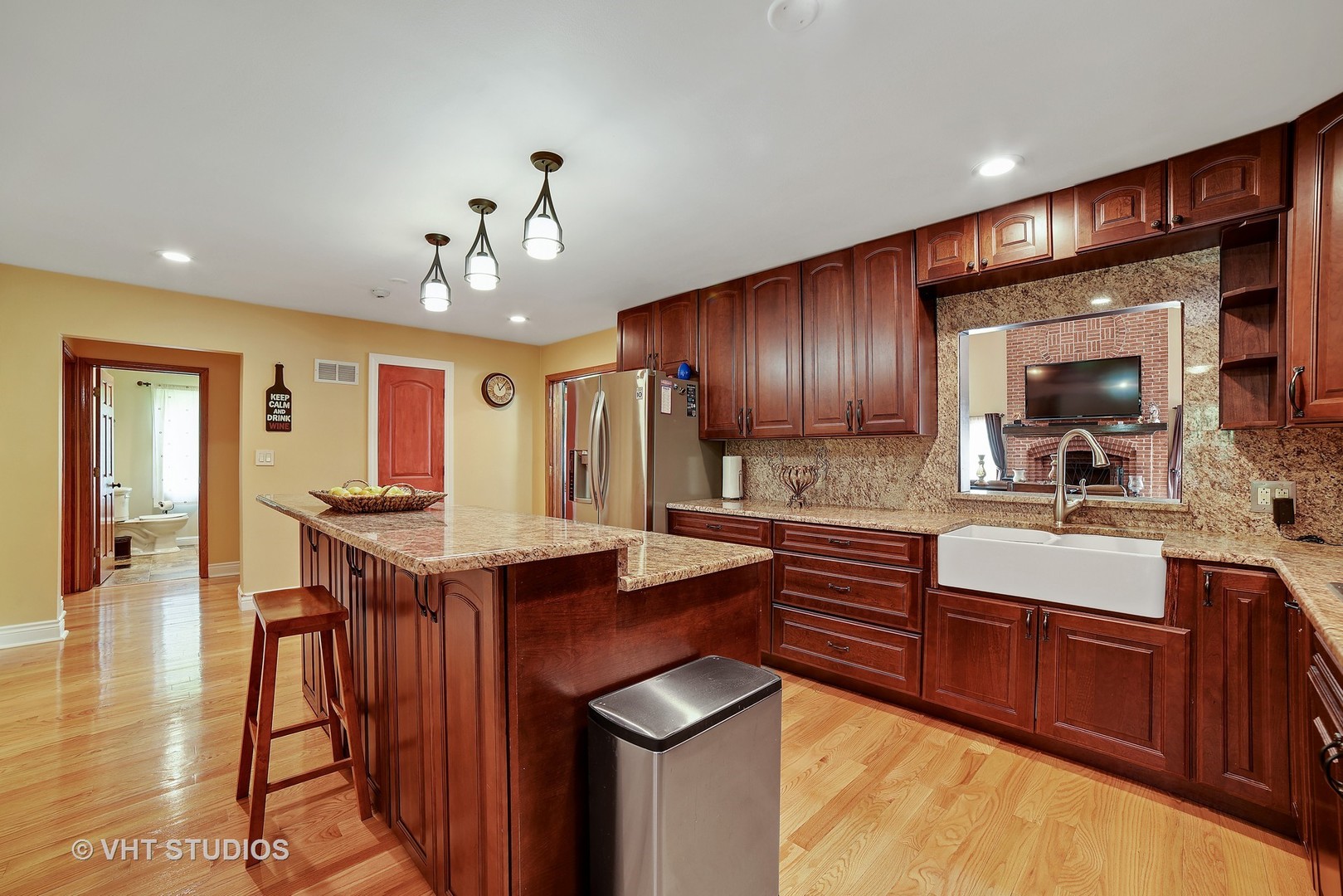 972 High Point Lane Streamwood, IL 60107 - Photo 9 of 26 a kitchen with stainless steel appliances granite countertop a sink stove and wooden cabinets