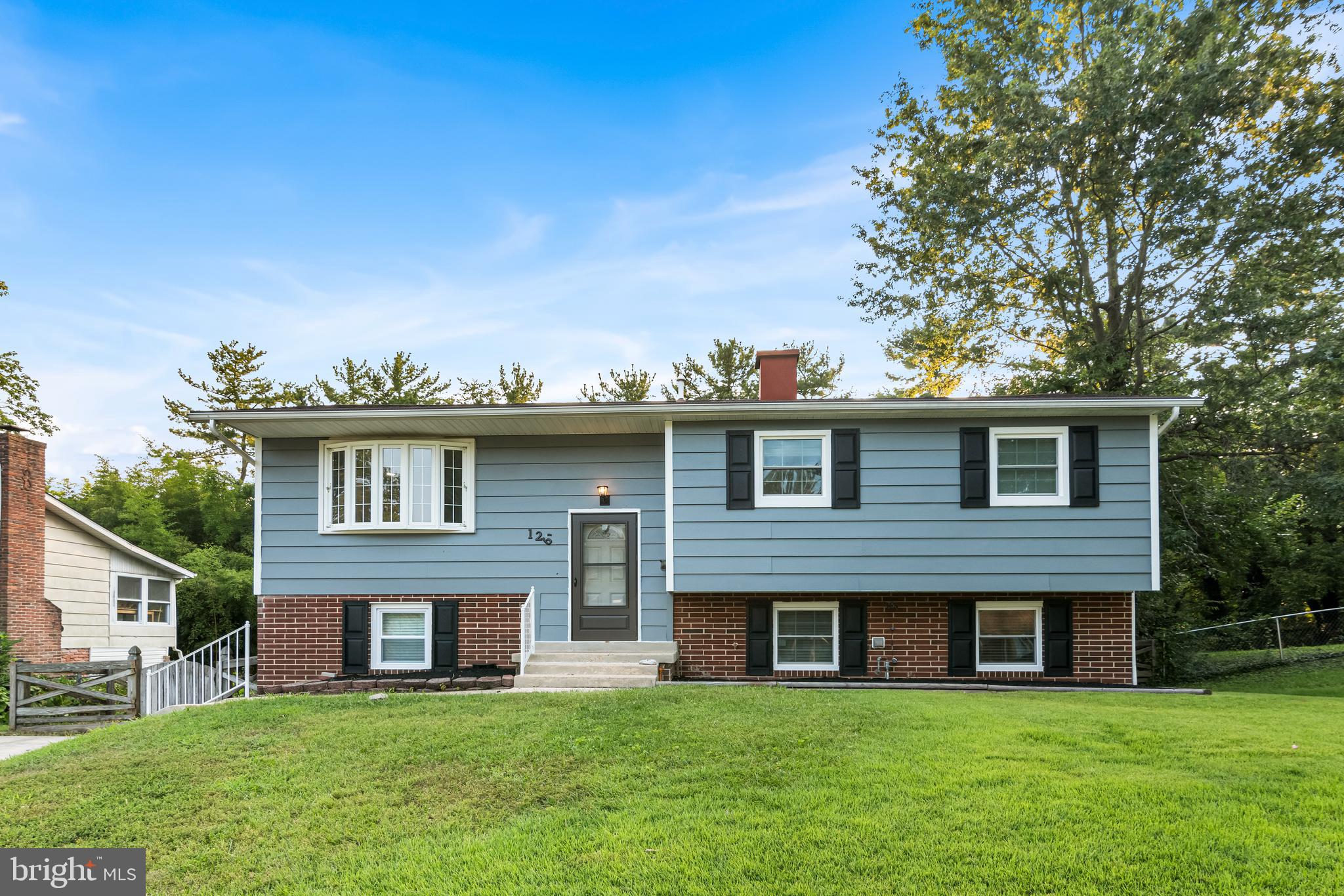 126 Doncaster Road Joppa, MD 21085 - Photo 1 of 23 a view of a brick house with a yard