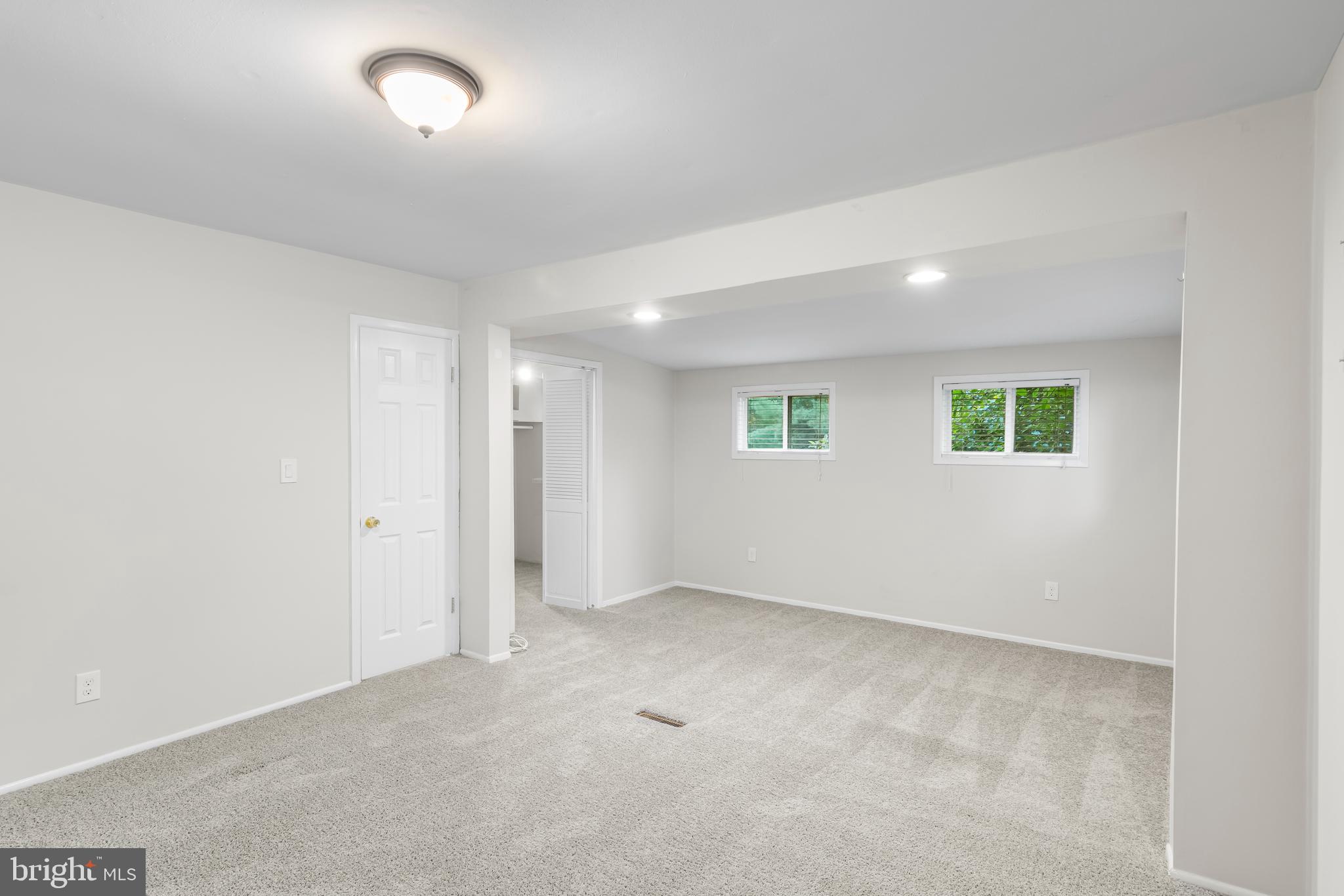 126 Doncaster Road Joppa, MD 21085 - Photo 13 of 23 an empty room with a empty space and windows