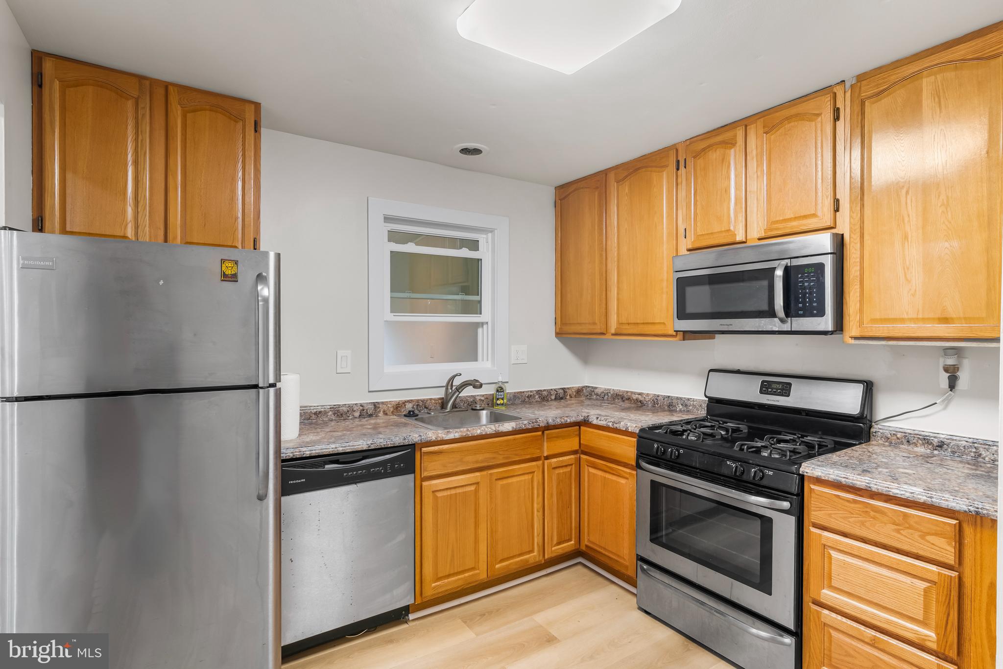 126 Doncaster Road Joppa, MD 21085 - Photo 9 of 23 a kitchen with a sink a stove and refrigerator