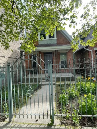 a view of a house with a tree front of house