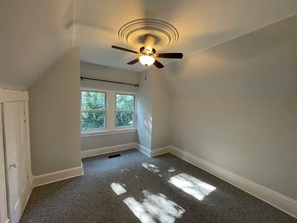 a bathroom with a sink toilet a mirror and shower