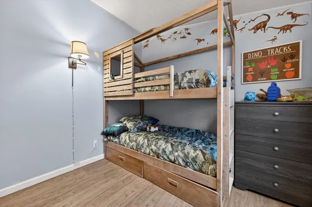 a bed room with a bed and a window