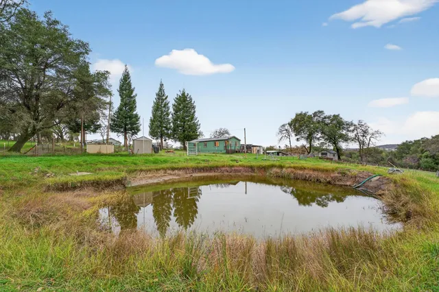 a view of lake with green space