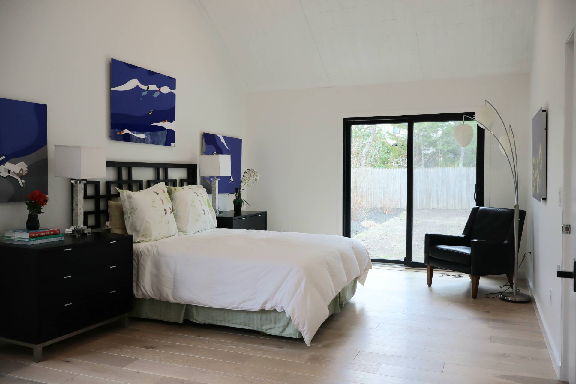 10 Hampton Street Westhampton Beach, NY 11978 - Photo 12 of 20 a bedroom with a bed and wooden floor