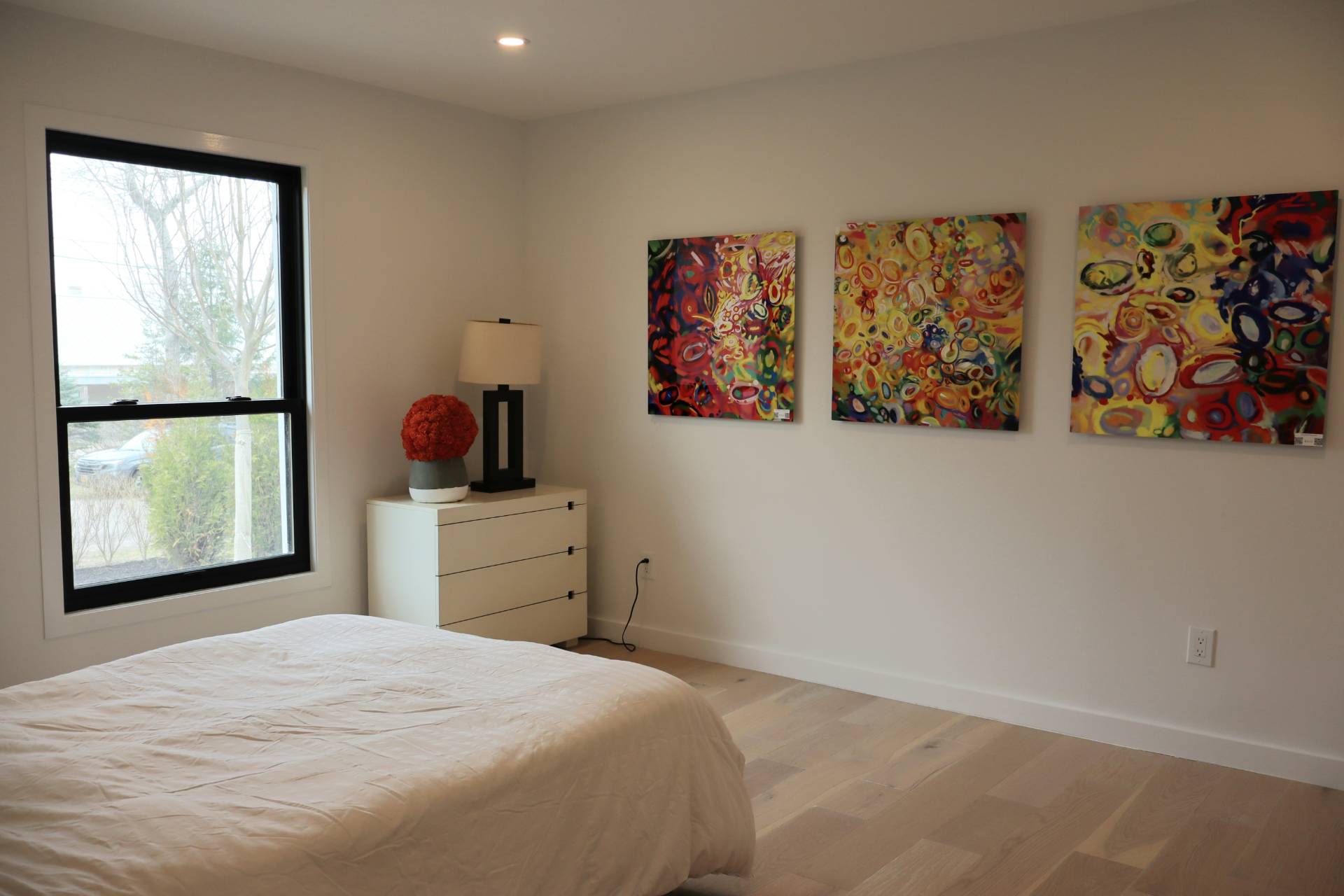 10 Hampton Street Westhampton Beach, NY 11978 - Photo 14 of 20 a bedroom with a bed and a window