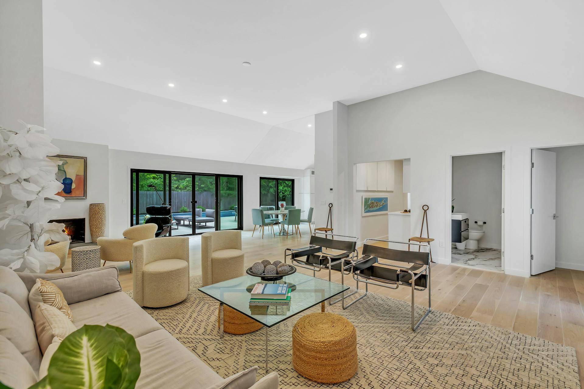 10 Hampton Street Westhampton Beach, NY 11978 - Photo 3 of 20 a living room with fireplace furniture and a large window
