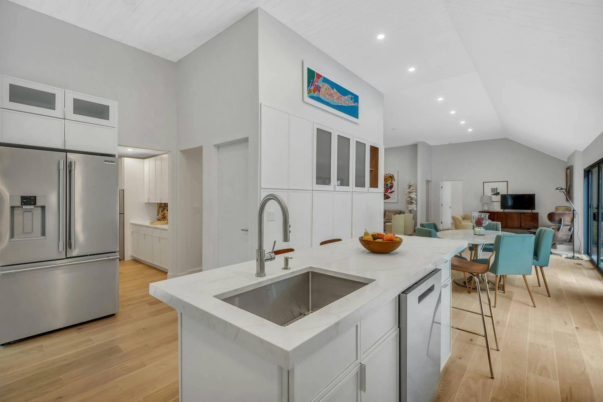 10 Hampton Street Westhampton Beach, NY 11978 - Photo 7 of 20 a kitchen with stainless steel appliances granite countertop a sink and a refrigerator