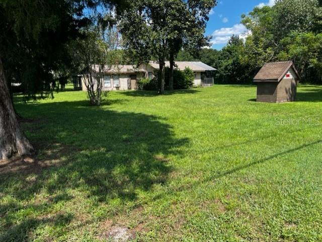 17479 Squirrel Prairie Road Brooksville, FL 34604 - Photo 1 of 1 a view of a house with a backyard
