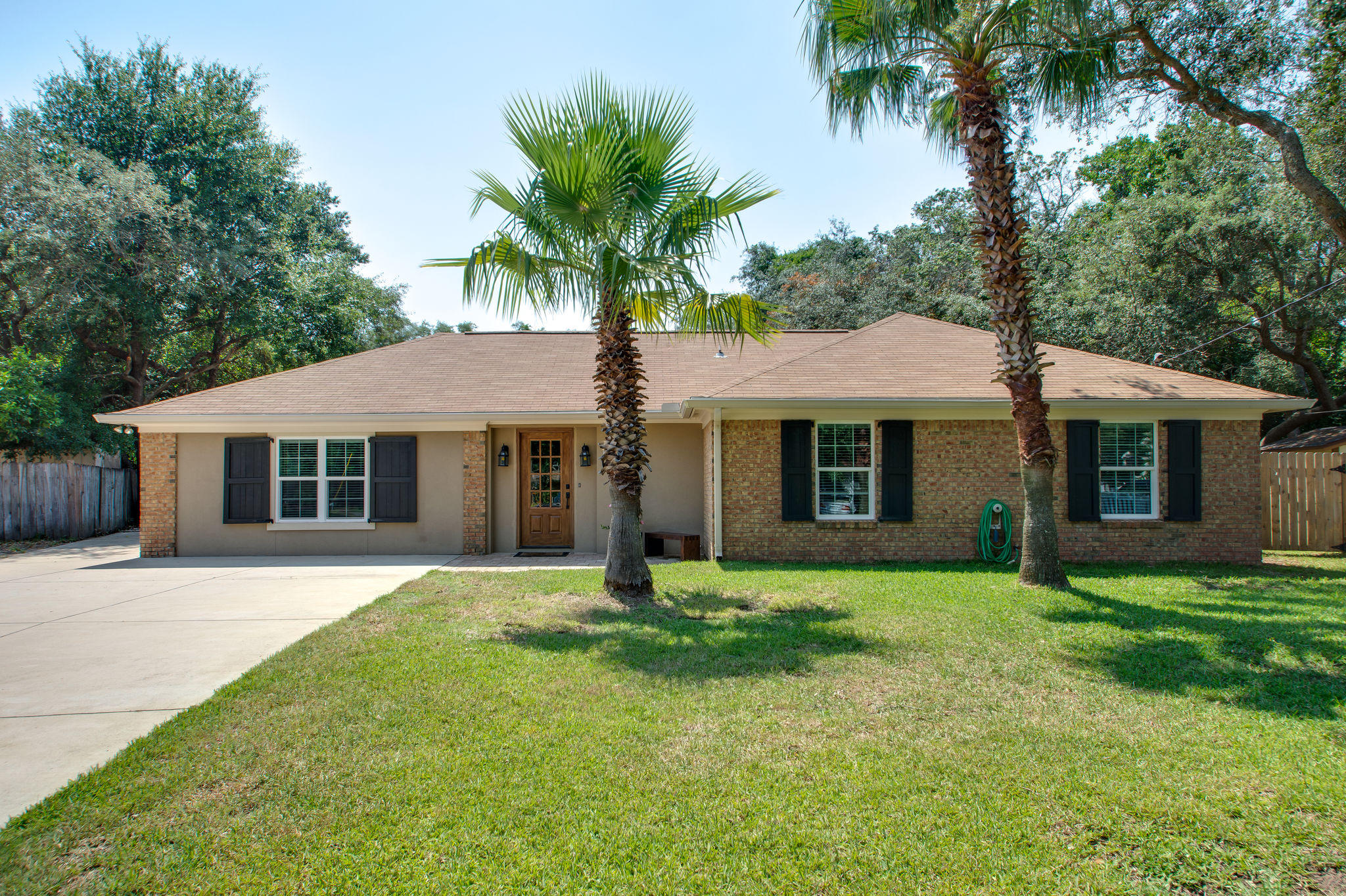 1146 Bay Court Destin, FL 32541 - Photo 1 of 32 a front view of a house with a garden