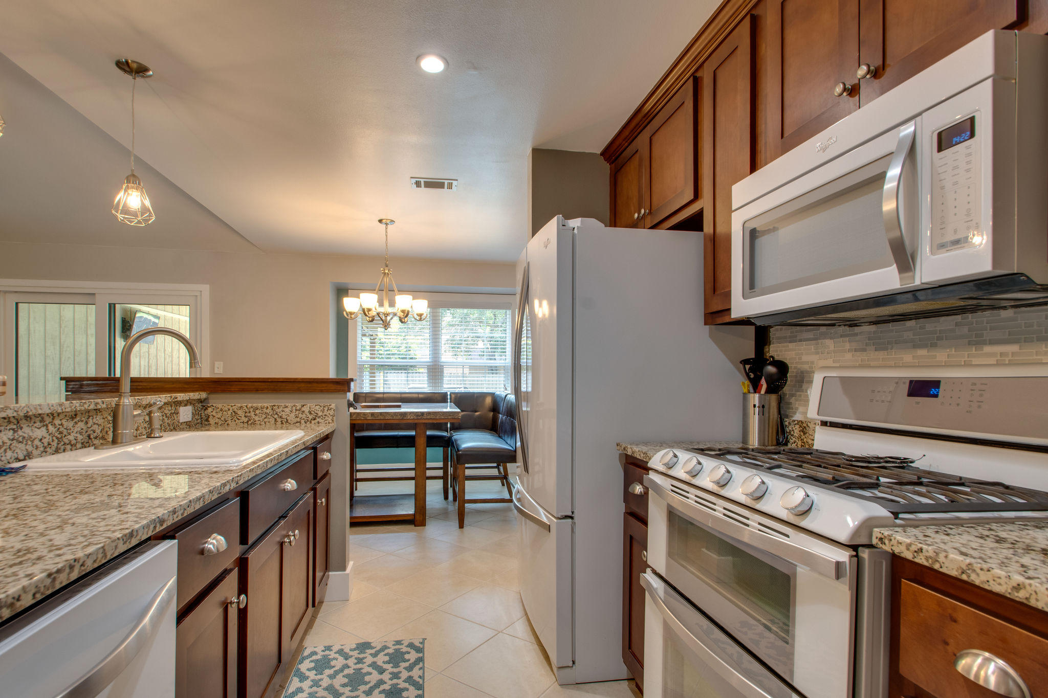 1146 Bay Court Destin, FL 32541 - Photo 12 of 32 a kitchen with a stove and a microwave
