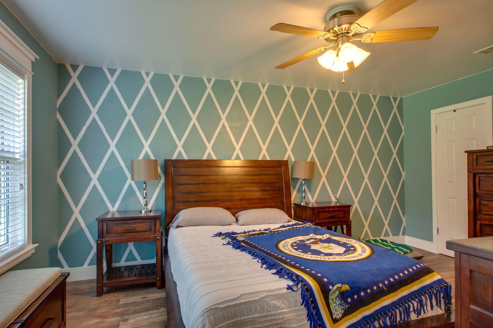 1146 Bay Court Destin, FL 32541 - Photo 17 of 32 a bedroom with a bed and a chandelier